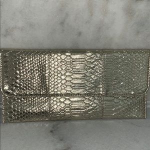 Never used gold snake skin clutch